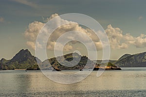 Islets and beaches on Rinca Island westside coast, Indonesia photo