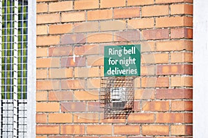 Ring bell for deliveries sign at construction site entrance