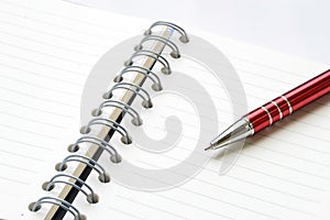 Ring binder book or notebook with pen