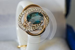 Ring with a blue stone in box