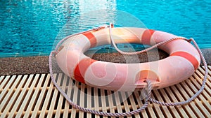 Ring buoy or Life preserver locate at swimming pools in evening