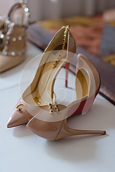 Ring, earrings and necklace on high heel stilettos