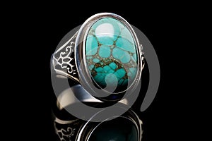 Ring features a substantial turquoise natural stone set in silver against a black background