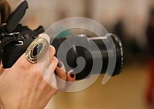 Ring on the hand of a female photographer photo