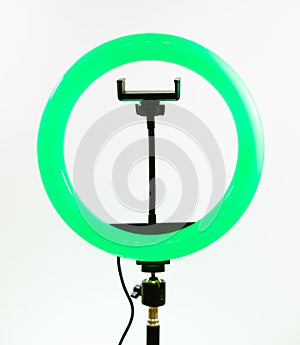 Ring lamp with a smartphone holder. Green light