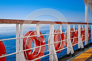 Ring lifebuoy on big boat. Obligatory ship equipment. Personal flotation device. Prevent drowning.
