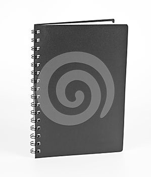 Ring notebook with black cover on white background.