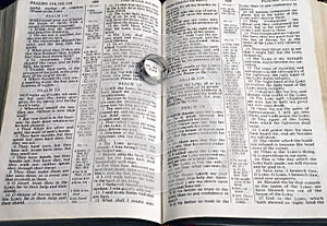 Ring on pages of open bible photo