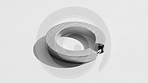 Ring with a sleek brushed surface casting a shadow on a light