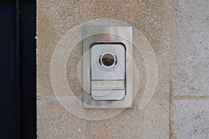 Ring surveillance video on modern house with contemporary doorbell near door