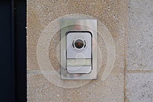 Ring surveillance video on modern house with contemporary doorbell near door photo