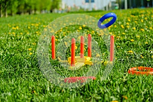 Ring throw summer game on a green lawn in the sun