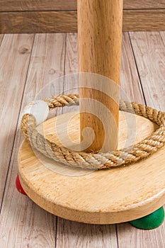 Ring Toss on Wooden Background