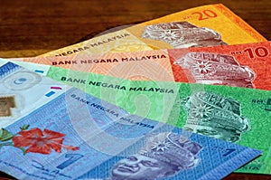 Ringgit Malaysia money laying on the wooden table