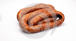 Rings of country style smoked sausage, isolated on a white background. Traditional Polish meat sausage, packshot photo.