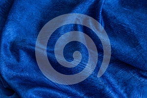 Rinkled blue cotton fabric with visible texture