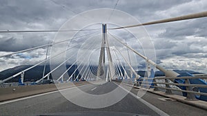 rio antirio bridge greece toll station cords signs patra city photo