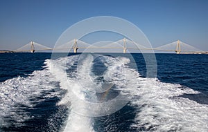 The Rio Antirrio Bridge or Charilaos Trikoupis Bridge, photo taken from the boat in summer morning.