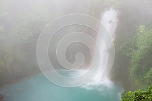 Rio celeste waterfall at foggy day