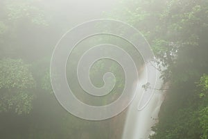 Rio celeste waterfall at foggy day