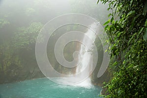 Rio celeste waterfall at foggy day