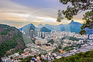 Rio De Janeiro Amazing View, Urca Hill, Sugar Loaf Mountain, Evening Clouds, Sunset. Buildings And Ocean Coastline.