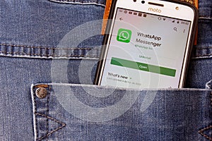 Rio de Janeiro, Brazil - February 14, 2020: Logo WhatsApp on the smartphone screen Moto G5s Plus, in the pocket of jeans