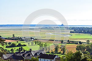 Rio makes its way between fields and farmland up to Mont Saint Michel, France