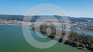 Rio Maule, constitucion, chile, horizontal aerial view with drone of the river and city photo