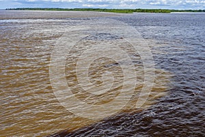 Rio Negro and Solimoes forming the Amazon River, Manaus, Amazonas State, Brazil photo