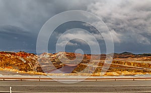 Rio Tinto mine and road on stormy day, wide angle photo