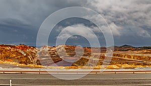 Rio Tinto mine and road on stormy day, wide angle photo