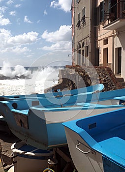 Riomaggiore Cinque Terre old fishing boats on street with histor