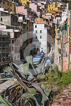 Riomaggiore fisherman village in a dramatic windy weather. Riomaggiore is one of five famous colorful villages of Cinque Terre in