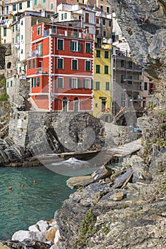 Riomaggiore fisherman village in a dramatic windy weather. Riomaggiore is one of five famous colorful villages of Cinque Terre in