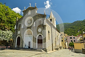 People walking next to Church of San Giovanni Battista