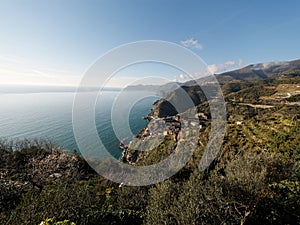 Riomaggiore - Village of Cinque Terre National Park at Coast of Italy. Beautiful colors at sunset. Province of La Spezia, Liguria