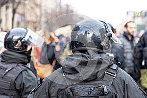 Riot police on duty during crowd protest or demonstration