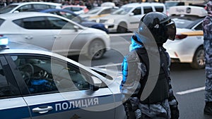 Riot police officers executes law enforcement during political demonstration.