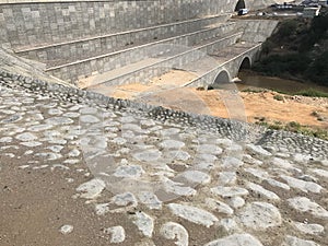 Rip rap works around a massive construction of road crossing culvert for Wadi passing location in muscat Oman and made of Boulder