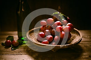 Rip of red grapes on a wooden textural