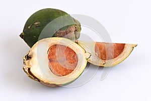 Ripe acera or betel palm nut fruit on white background with path photo