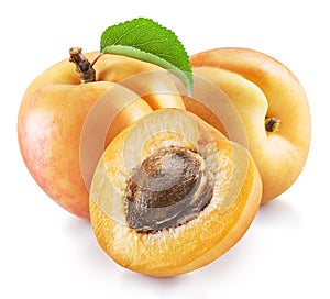 Ripe apricot fruits with green leaf and apricot half. File contains clipping path