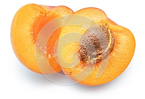 Ripe apricot halves on white background. File contains clipping path