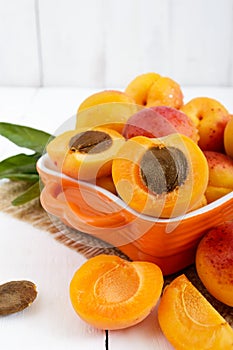 Ripe apricots in a ceramic bowl
