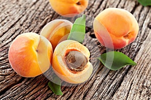 Ripe apricots on old wooden table