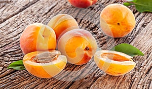 Ripe apricots on old wooden table