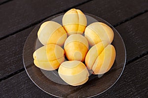 Ripe apricots on a wooden table