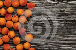 Ripe apricots on a wooden table