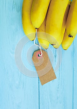 Ripe bananas on a blue wooden background nature tag